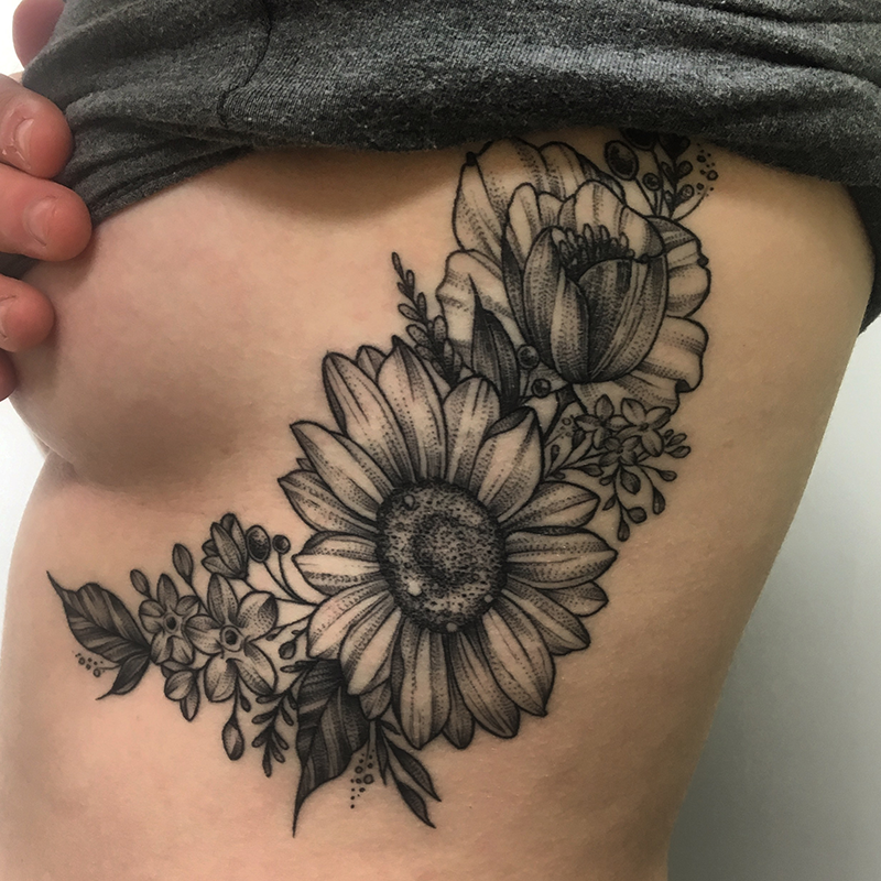 floral dotwork tattoo across ribs